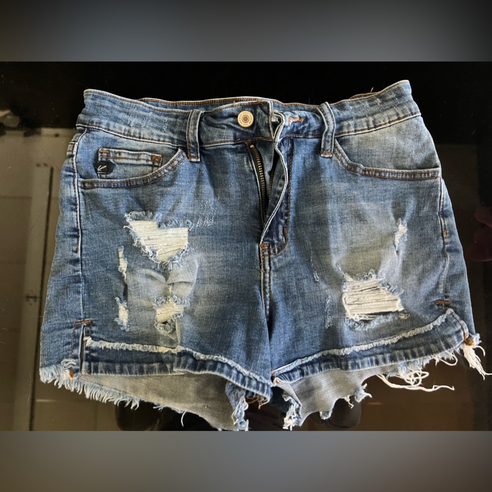 Kancan . Destroyed denim cut off shorts size 27.